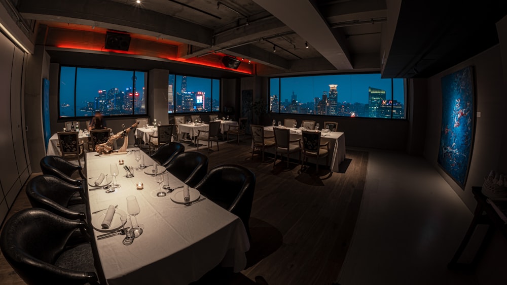 a restaurant with a view of the city at night