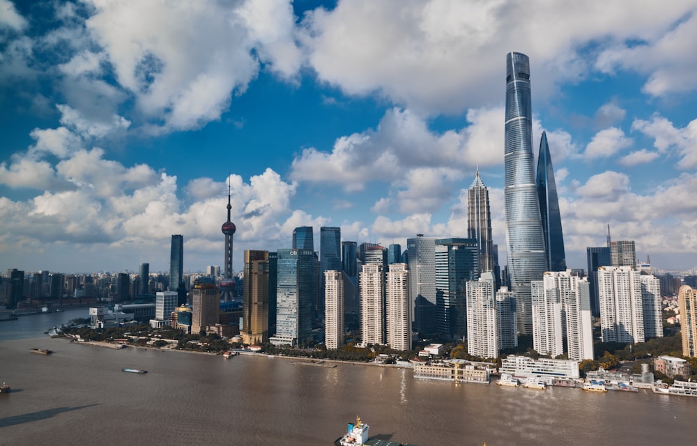 a large body of water with a city in the background