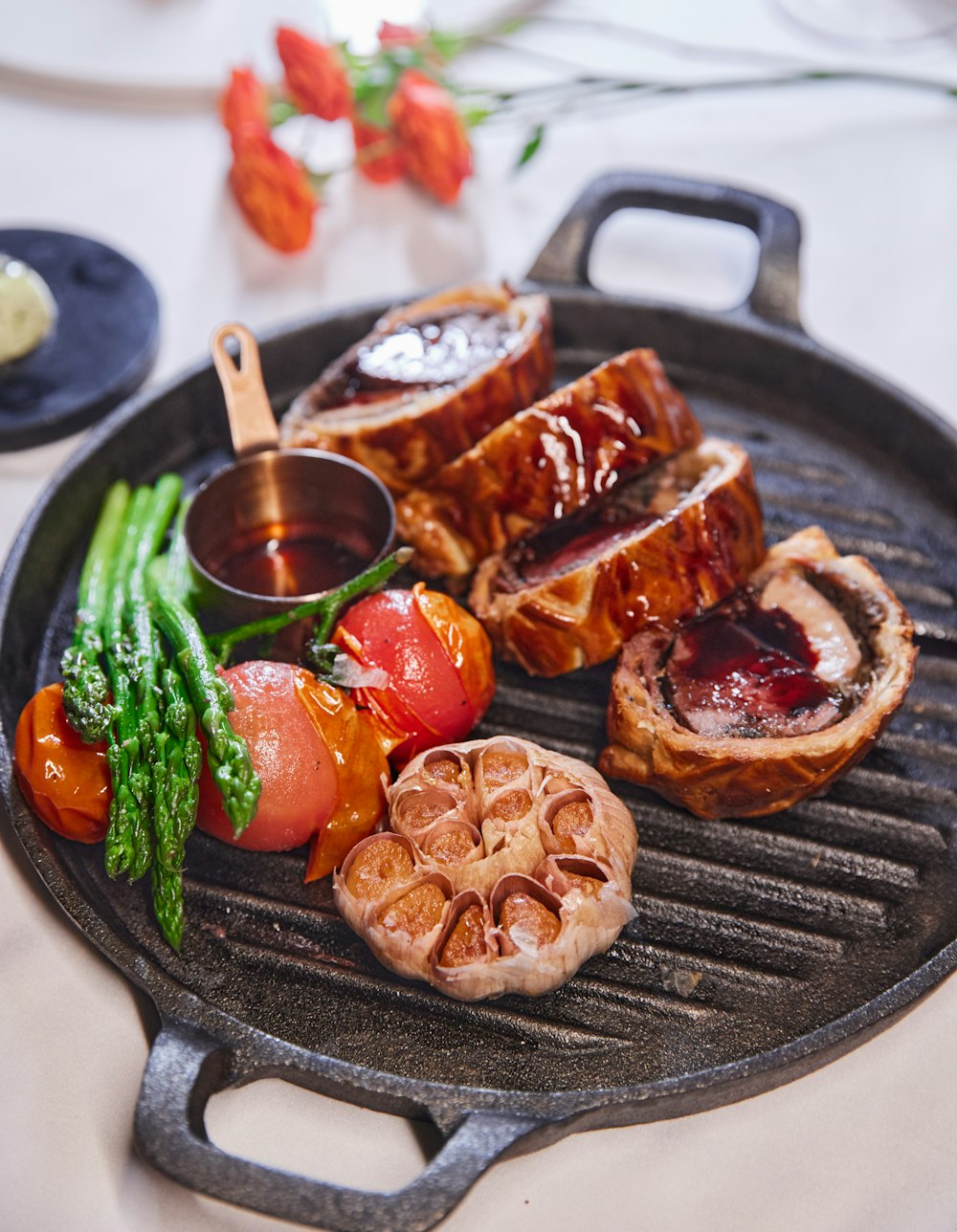 a close up of a plate of food on a grill