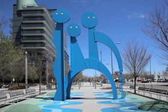 An abstract sculpture representing the 'third way' concept, placed in a minimalist urban setting.