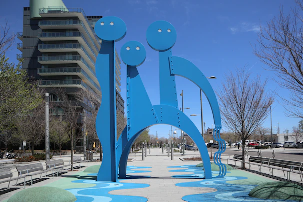 An abstract sculpture representing the 'third way' concept, placed in a minimalist urban setting.