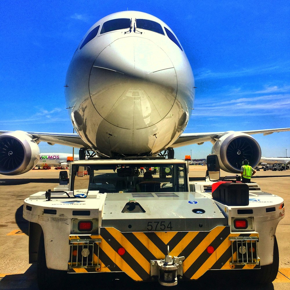 a large jetliner sitting on top of an airport tarmac