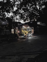 Tow truck parked on a city street at dusk.