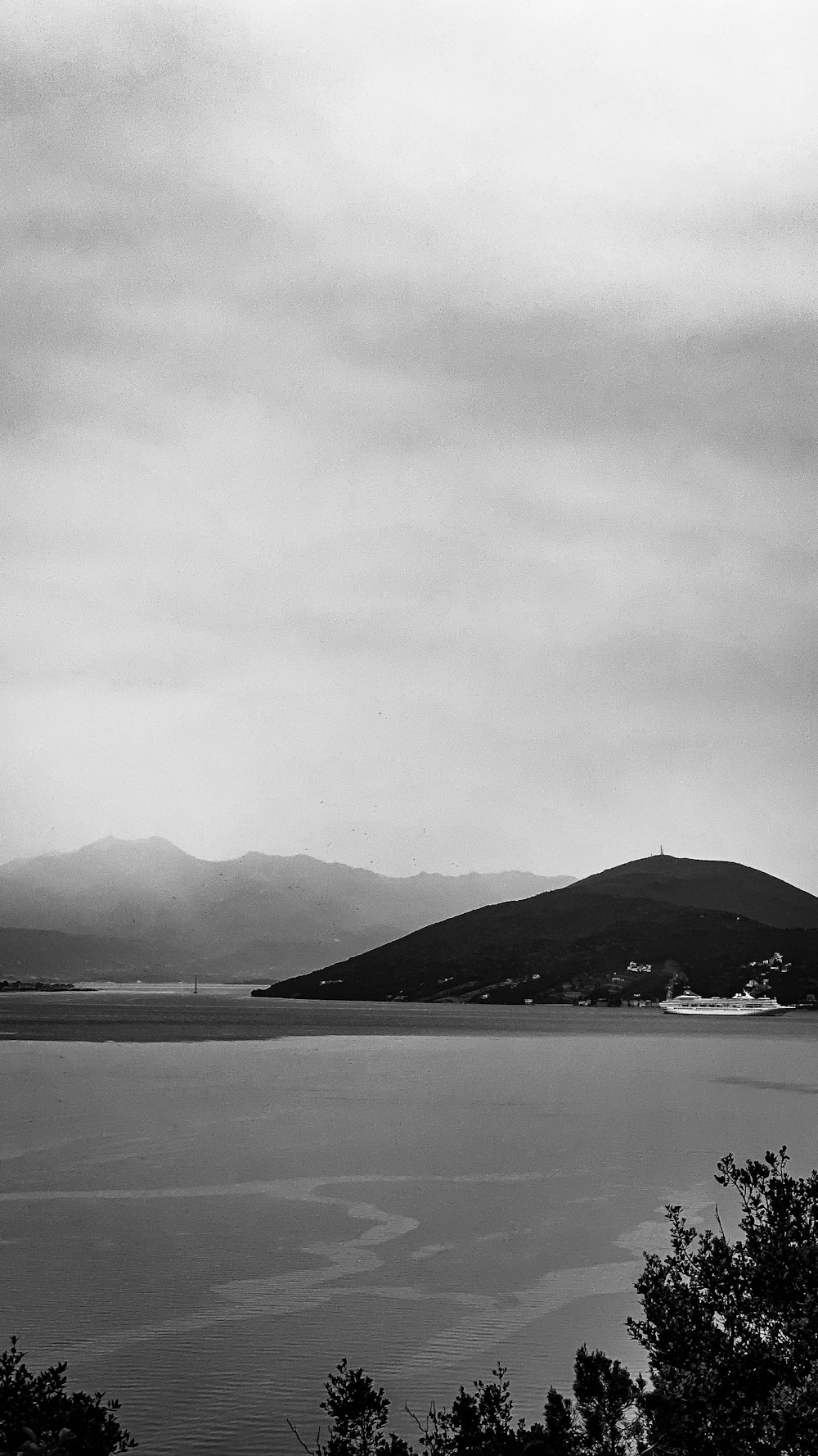 a black and white photo of a large body of water