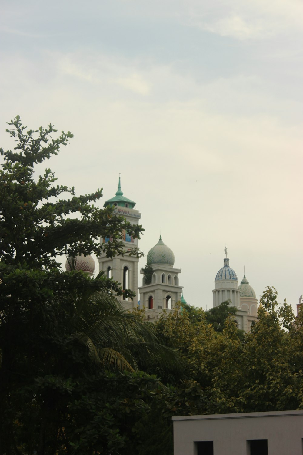 a view of a building with a clock tower in the background