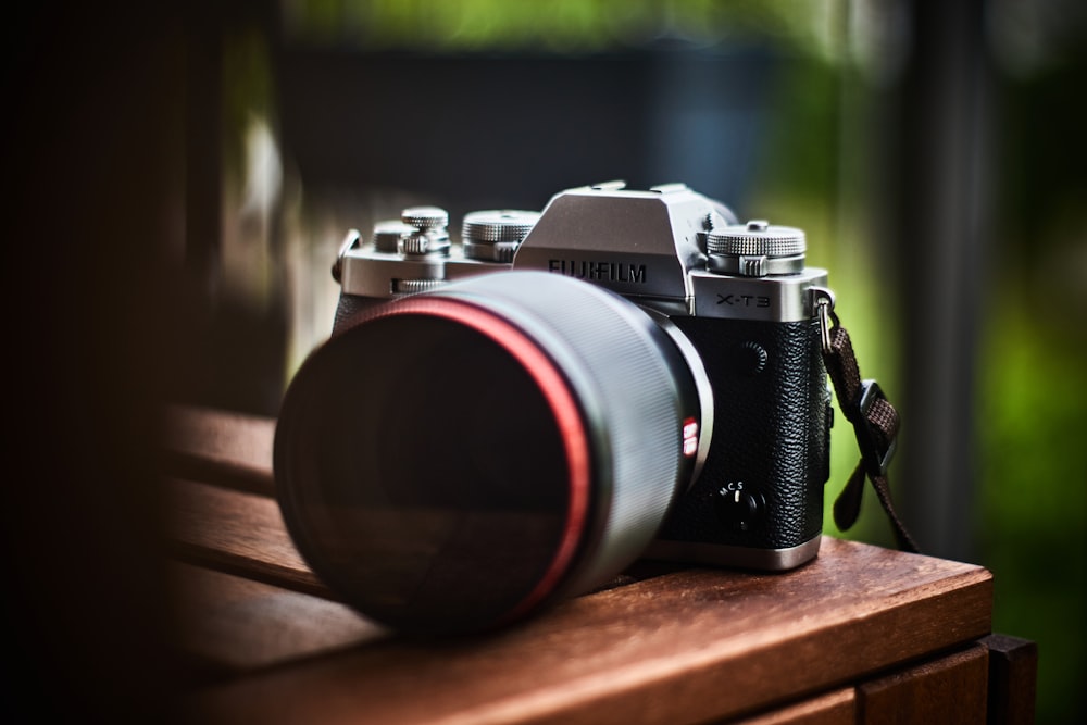 a camera sitting on top of a wooden table