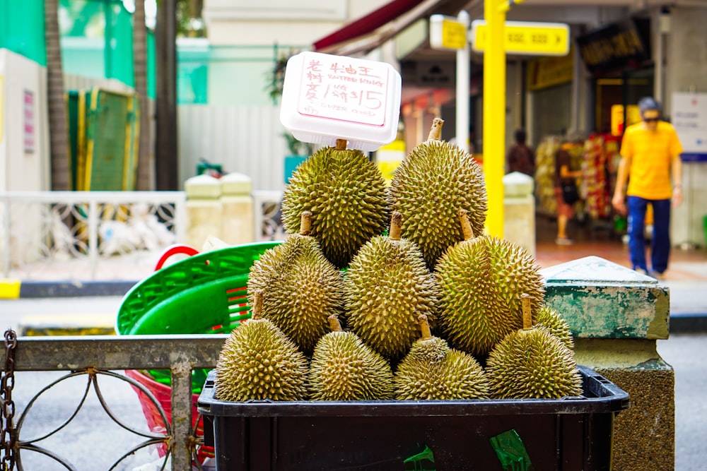 a pile of fruit sitting on top of a table