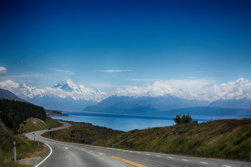 a road with a mountain in the background