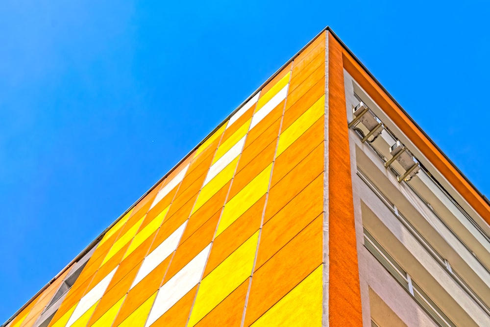 a tall building with a blue sky in the background