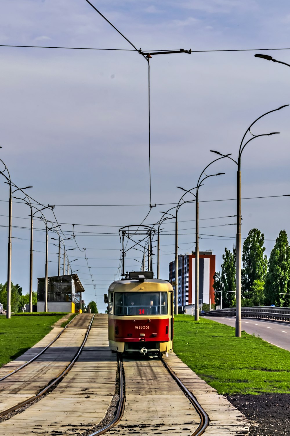 a red and yellow train traveling down train tracks