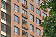 a tall brick building with balconies and balconies