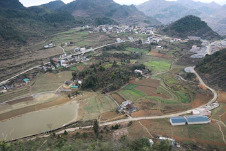 an aerial view of a small village in the mountains