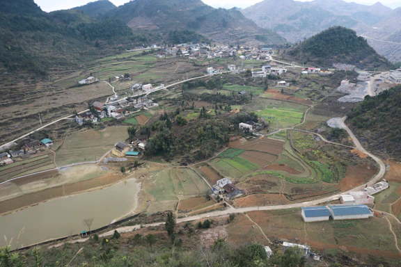 an aerial view of a small village in the mountains