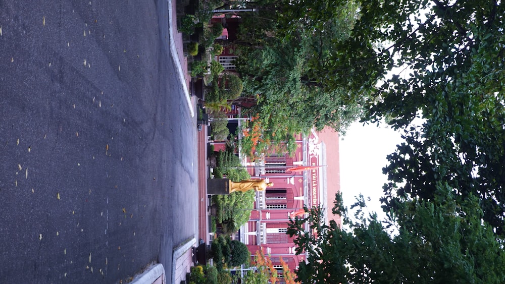 a street with a statue in the middle of it