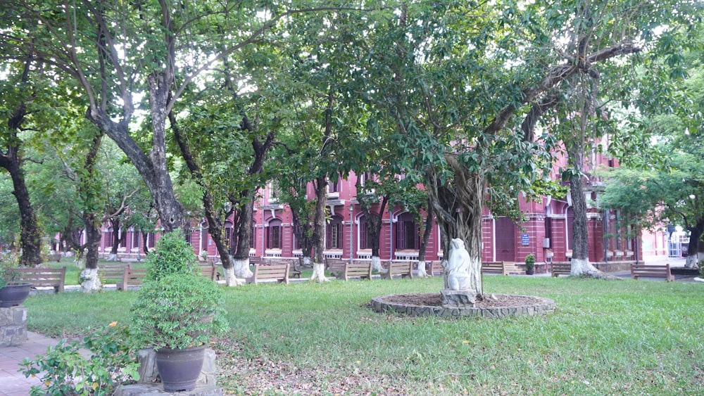 a cemetery with a statue in the middle of it