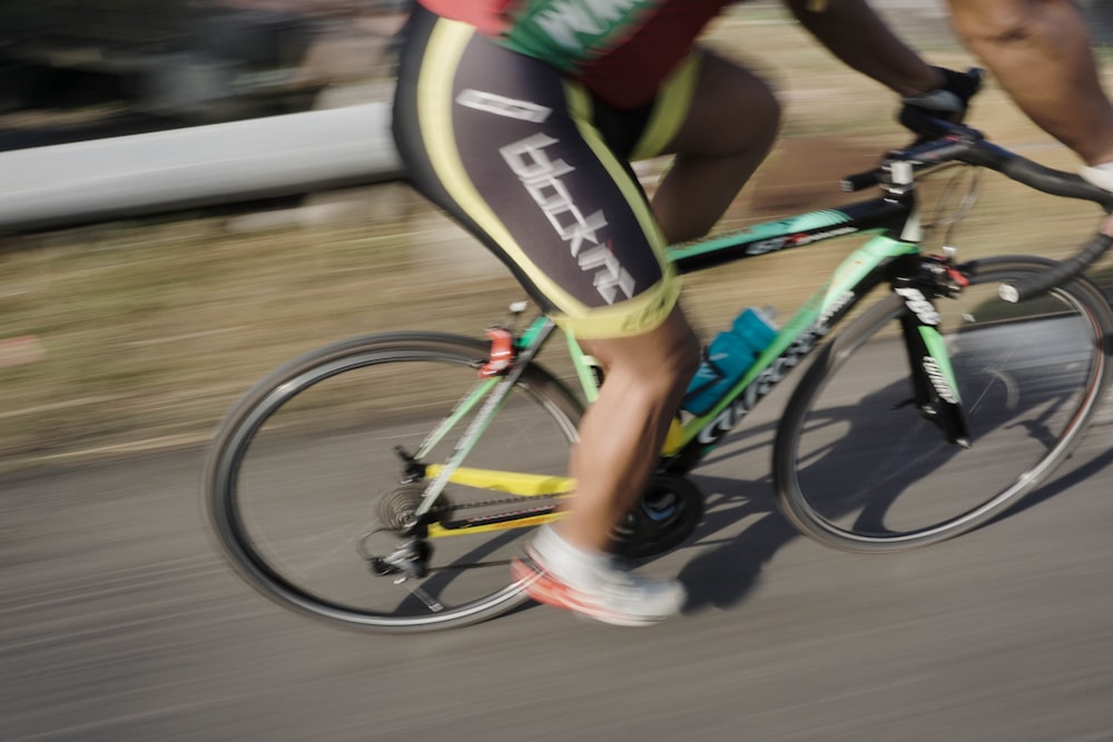 a man riding a bike down a street