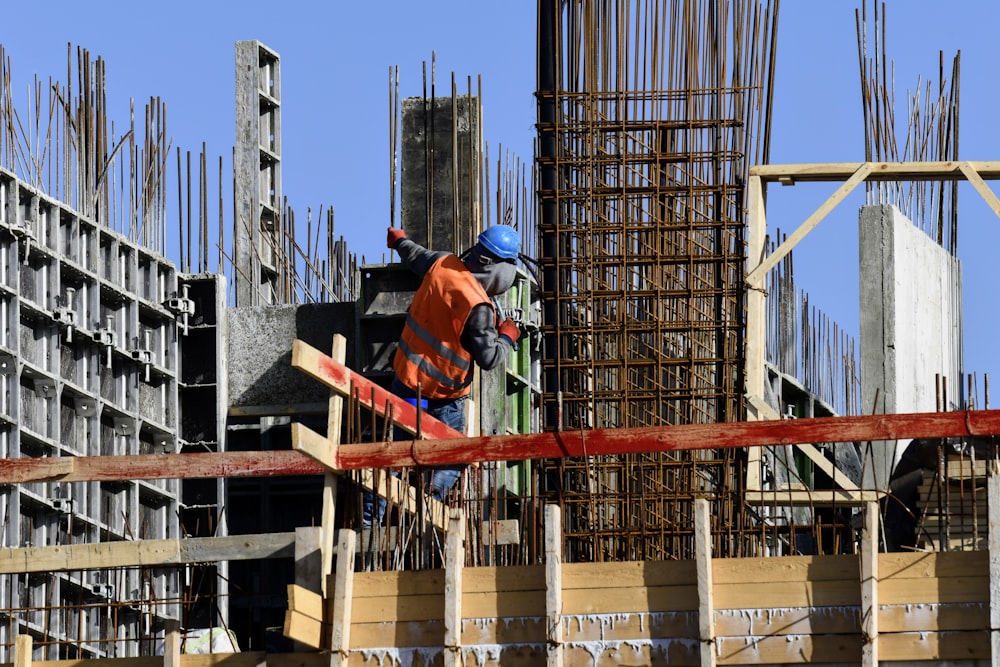 a construction worker working on a building under construction