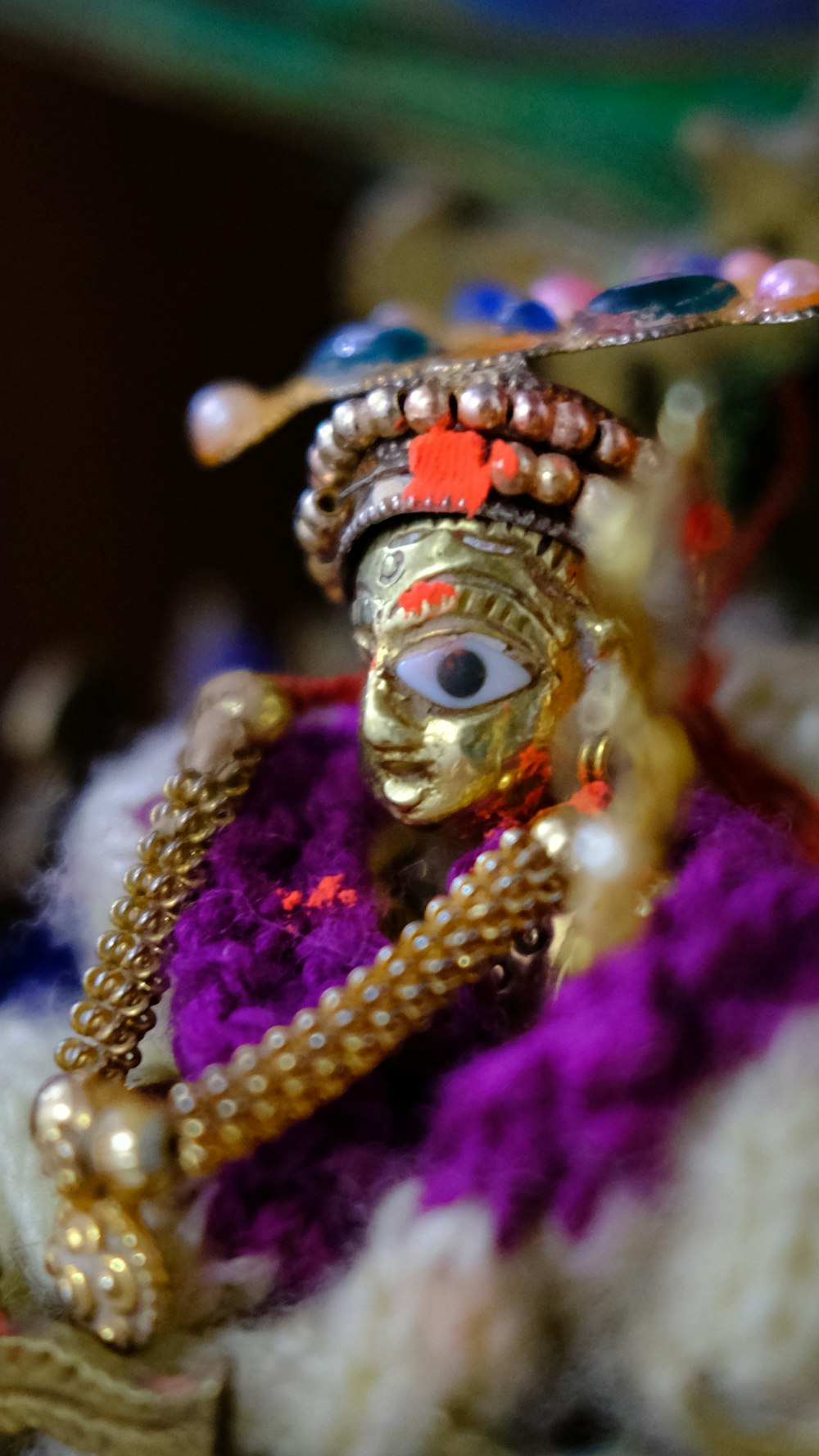 a close up of a figurine of a person wearing a headdress