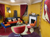 A renter-friendly living room makeover featuring removable wall decals and thrifted furniture.