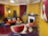 A cozy residential living room featuring elegant wall finishes and vibrant colors.