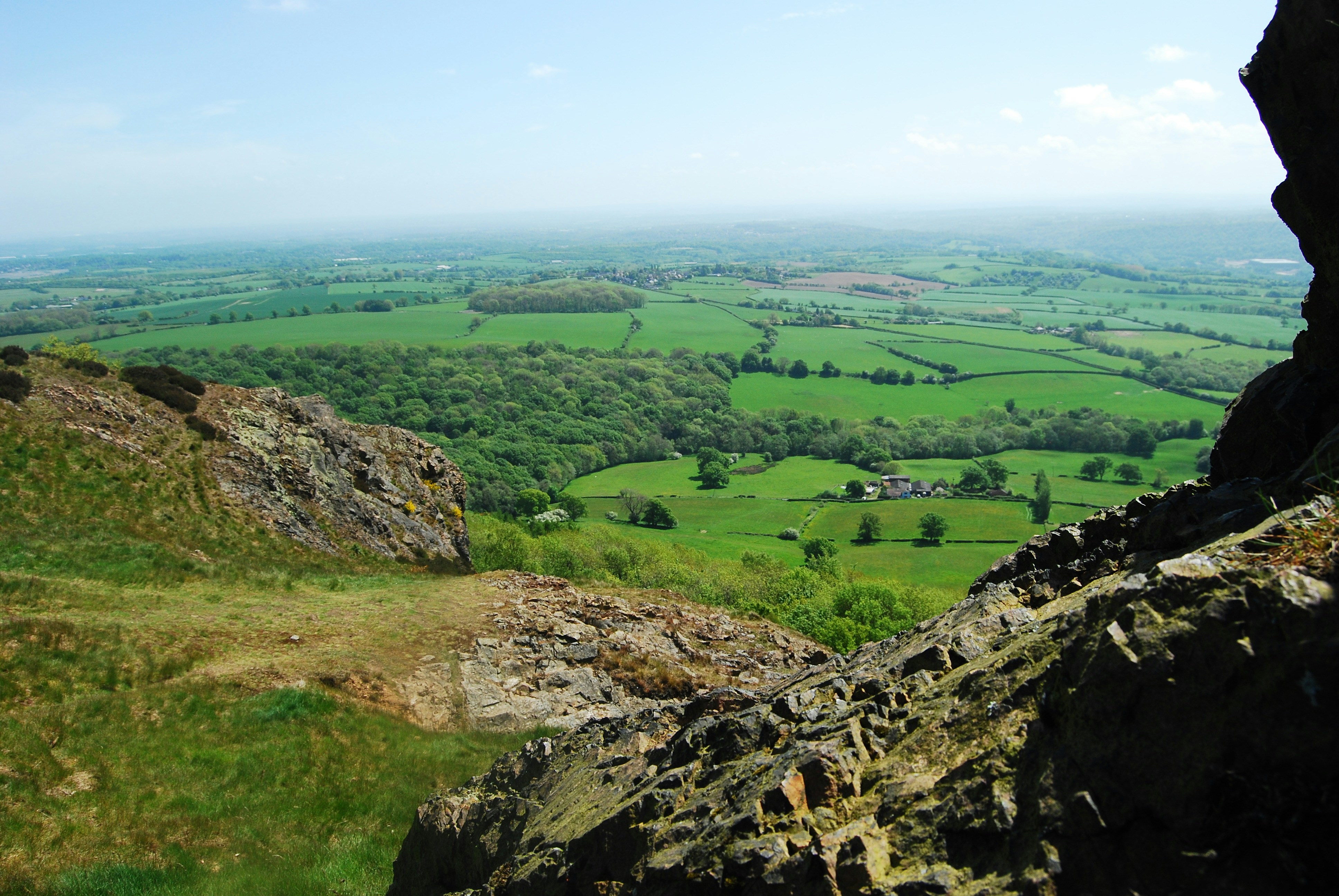 a view of the countryside from the top of a mountain