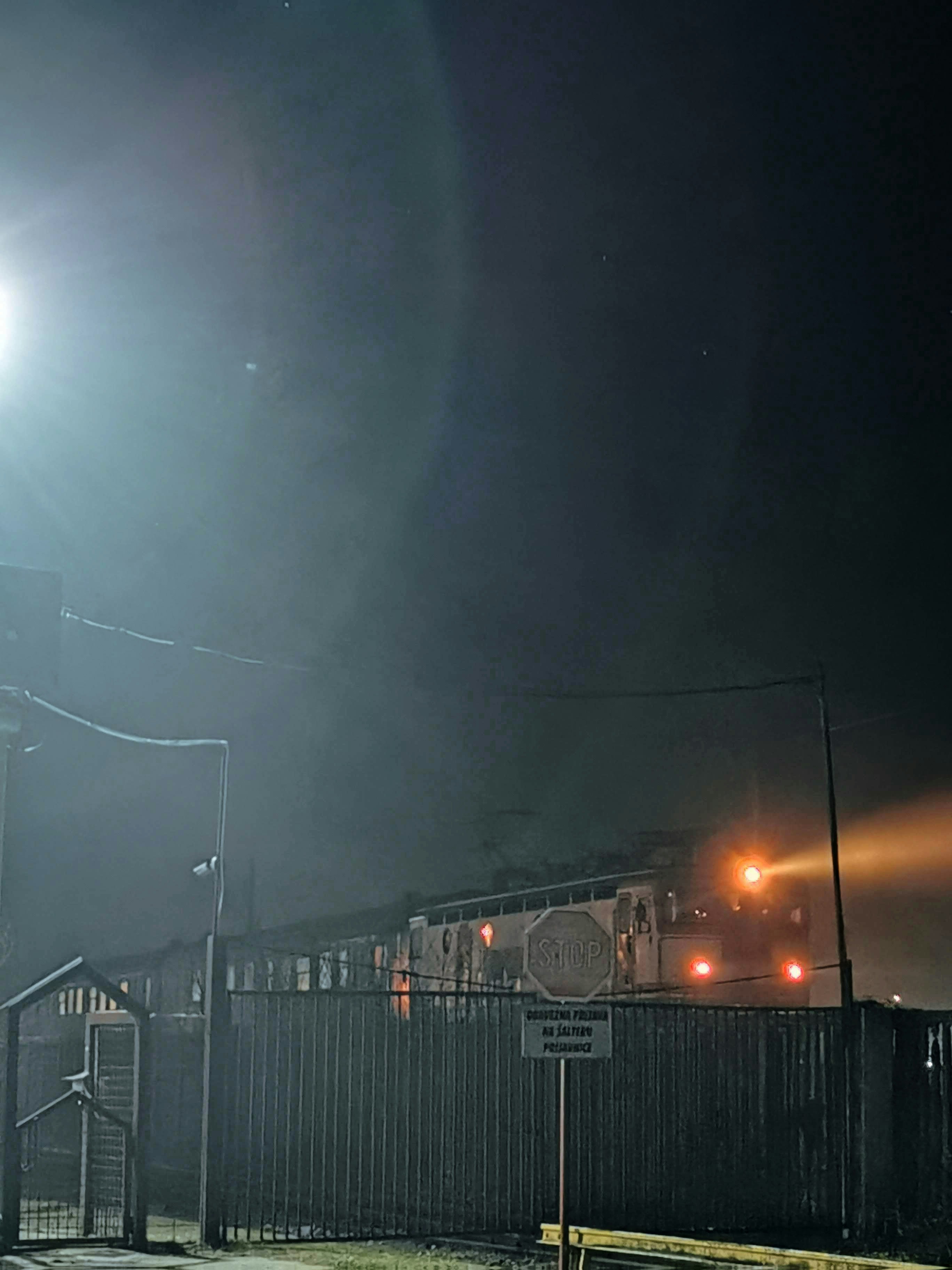 a train traveling down train tracks at night