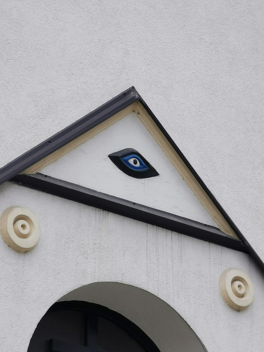 a close up of a building with an eye on it