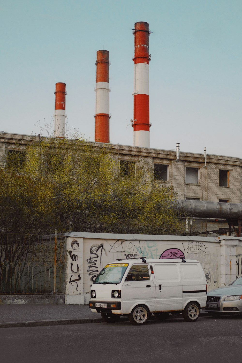 a white van parked in front of a building