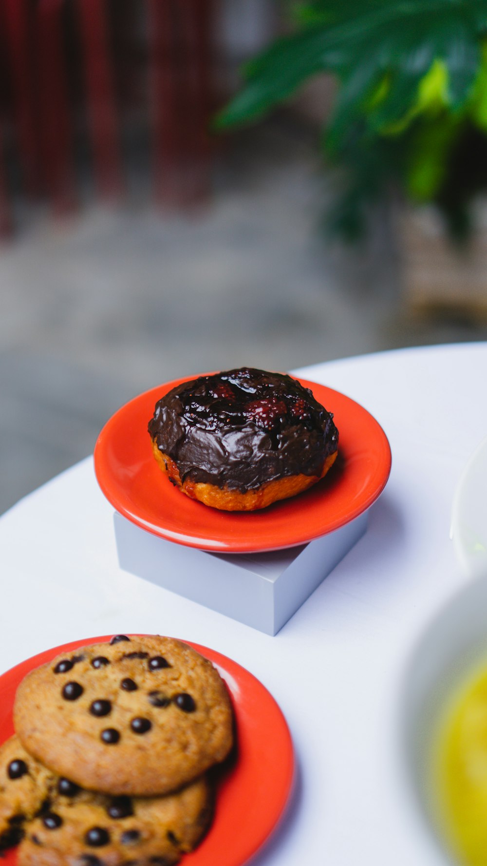 a table topped with two plates filled with cookies