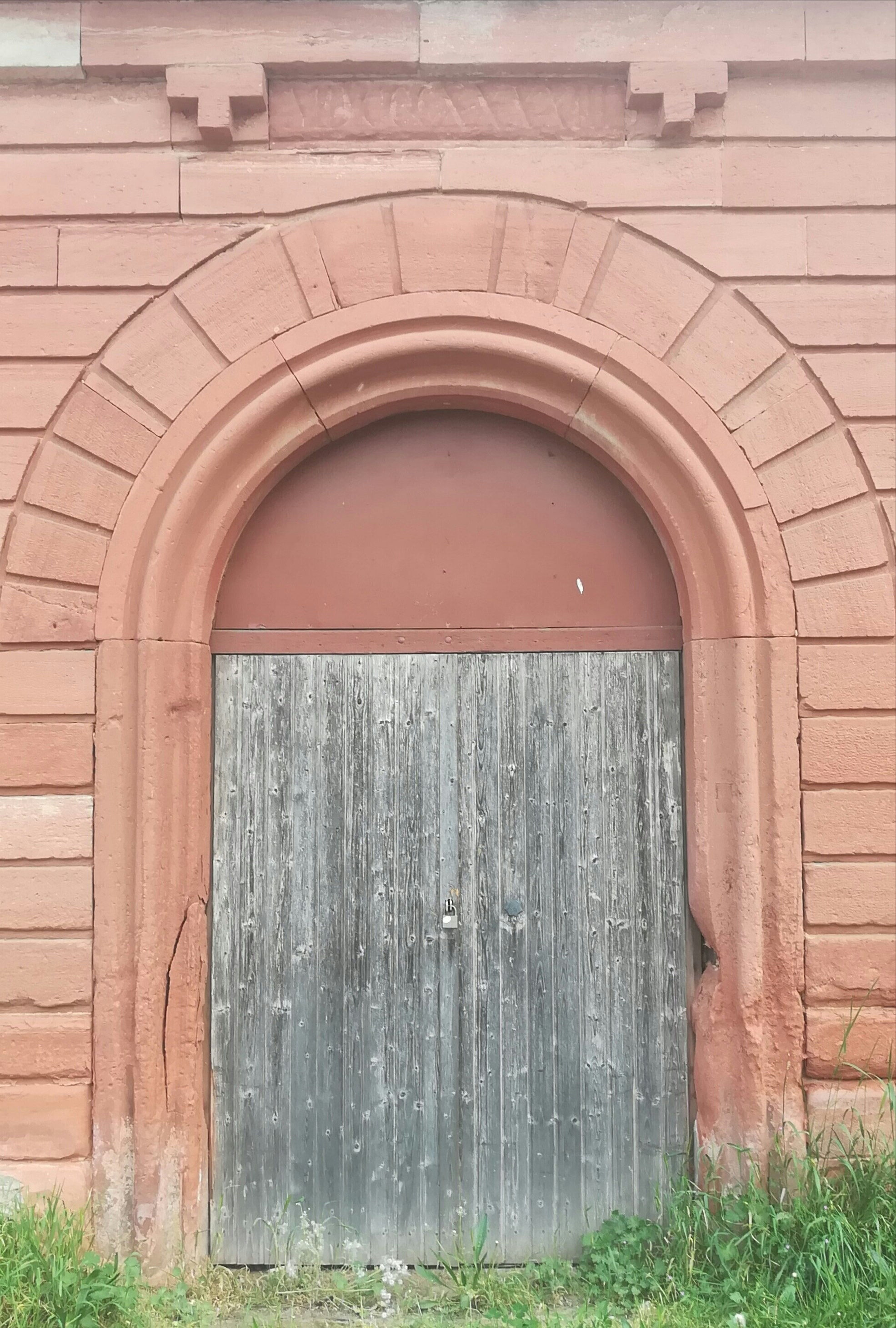 an old building with a large wooden door