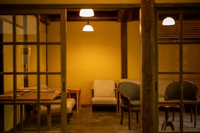 a room with chairs and a table with chairs