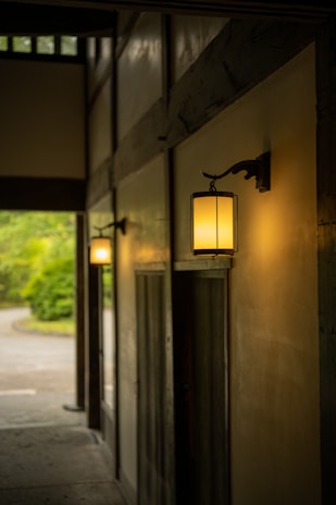 Classic lantern lighting casting a warm glow over a tailored millwork hallway.