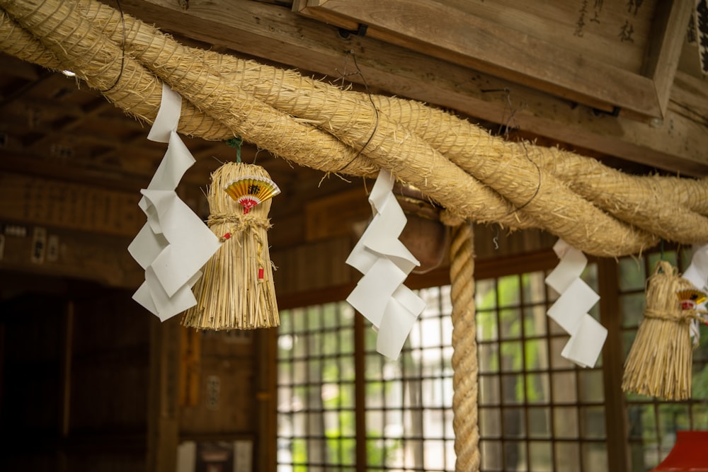 a group of paper decorations hanging from a ceiling