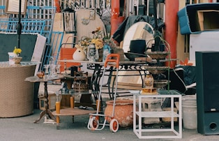 a pile of junk sitting on the side of a road