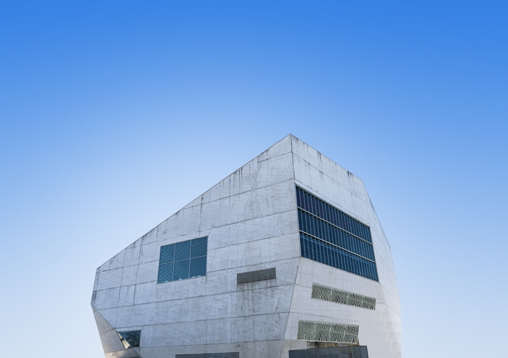 a large white building with a sky background
