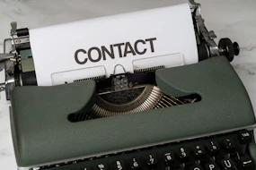 a close up of an old fashioned typewriter