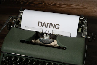 a close up of a typewriter with a paper on it