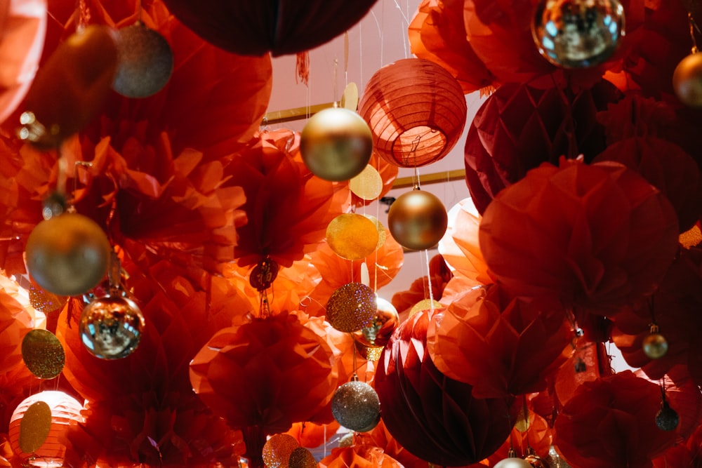 a room filled with lots of red and gold decorations