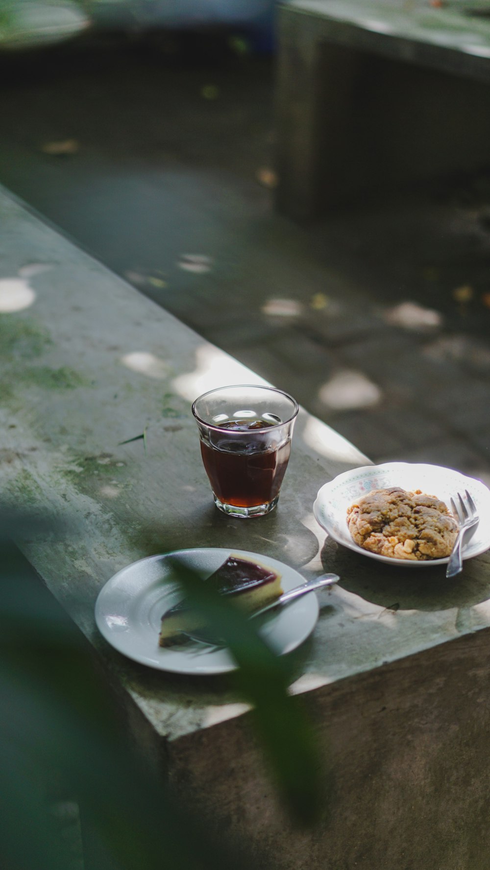 a table with a plate of food and a cup of tea