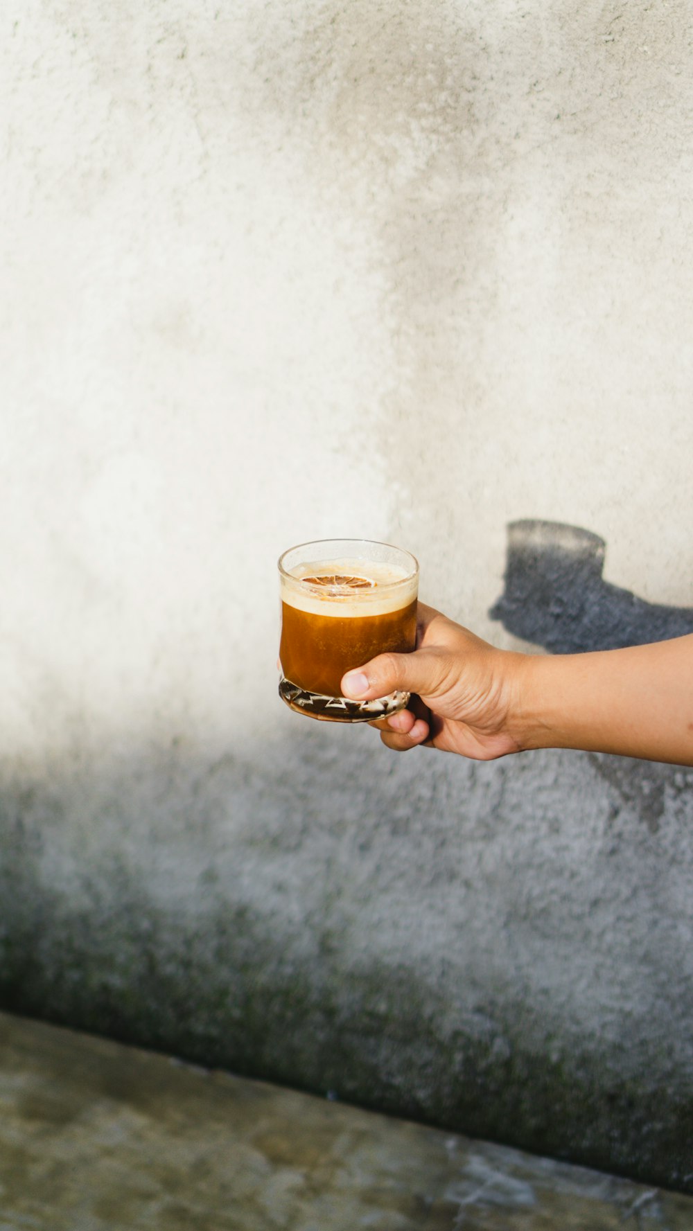 a person holding a beer in their hand