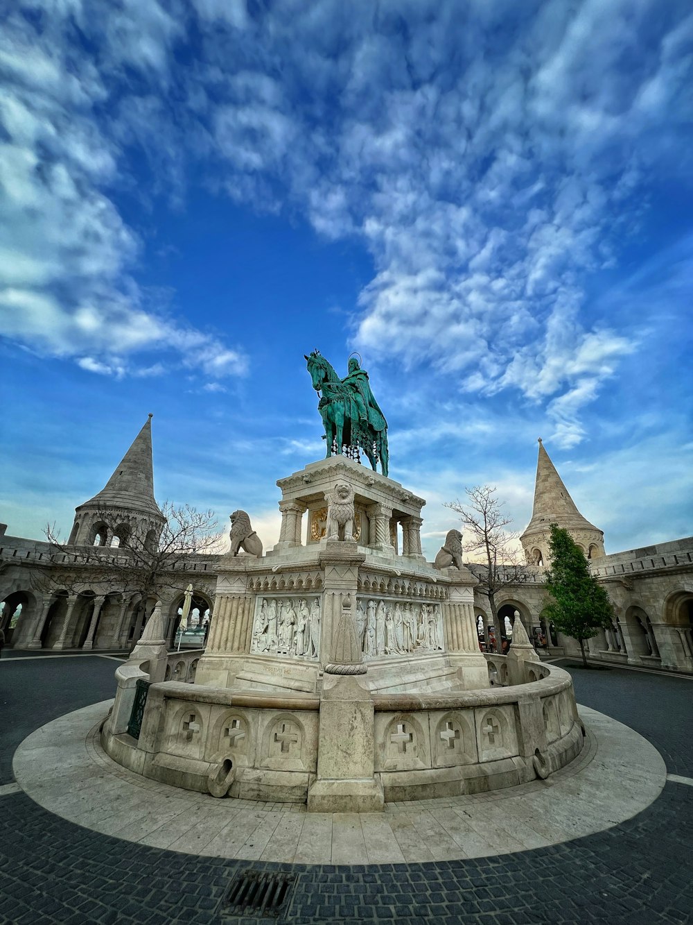 a statue of a horse on top of a fountain