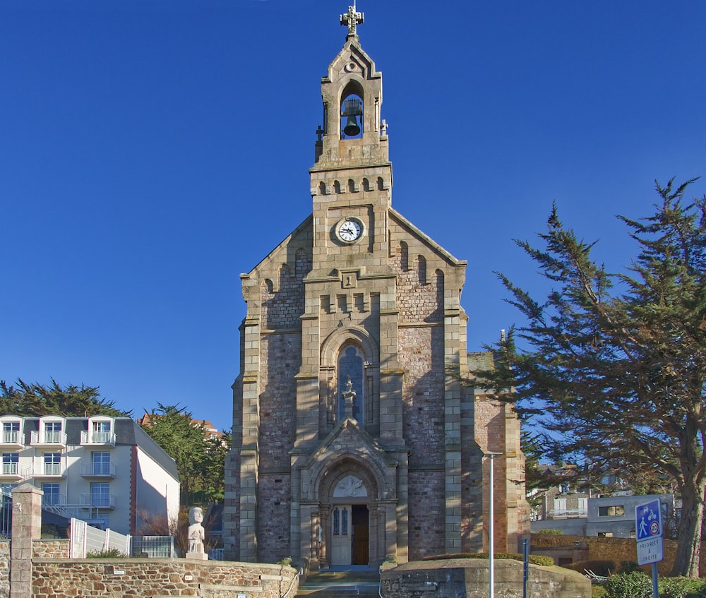 a church with a steeple and a clock tower