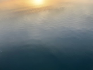 A subtle Indian-themed header image featuring a calm sunrise over the Ganges river with soft neutral tones.