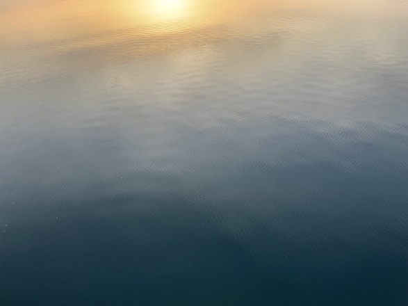 A subtle Indian-themed header image featuring a calm sunrise over the Ganges river with soft neutral tones.