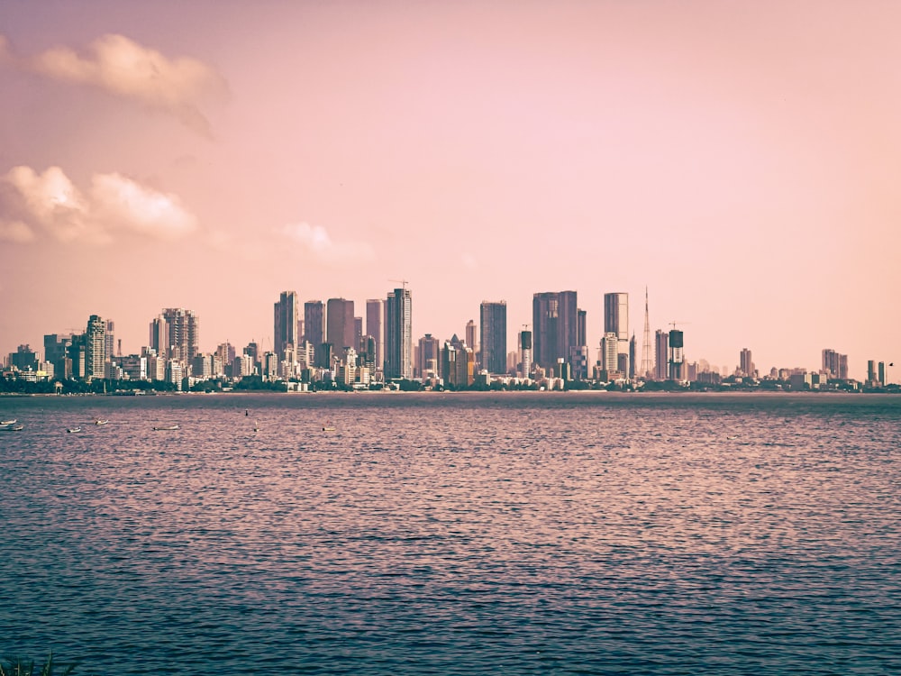 a large body of water with a city in the background