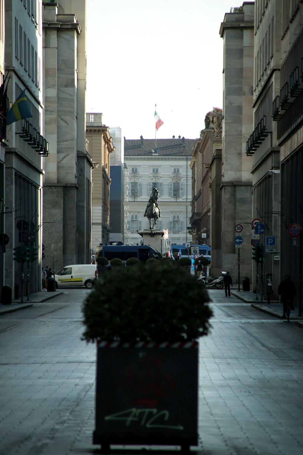 a planter sitting on the side of a street