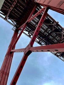a red metal structure against a blue sky