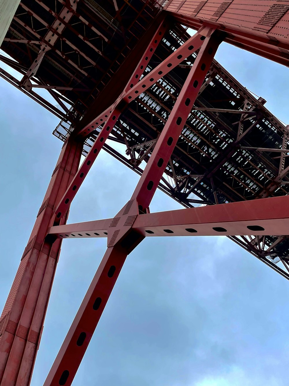 a red metal structure against a blue sky