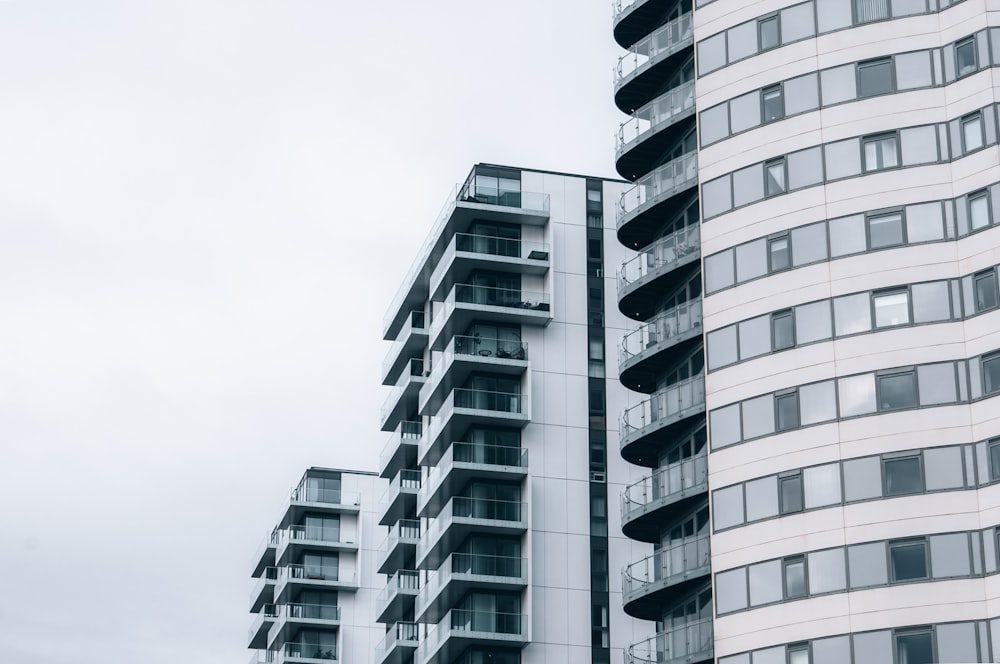 a couple of tall buildings next to each other