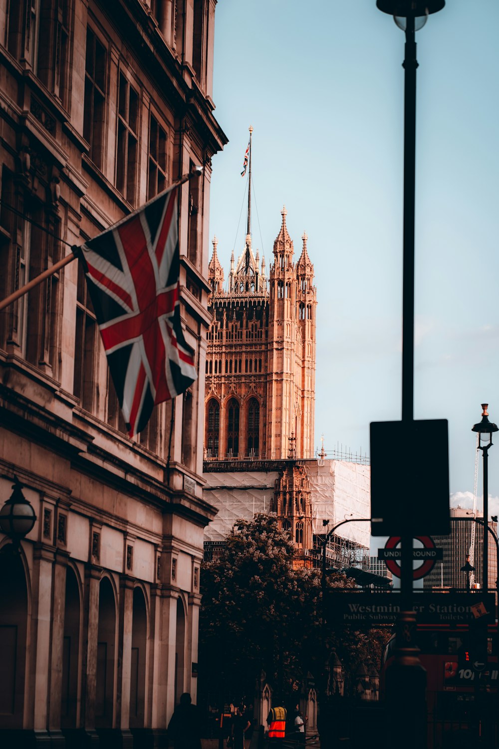 a british flag flying in front of big ben